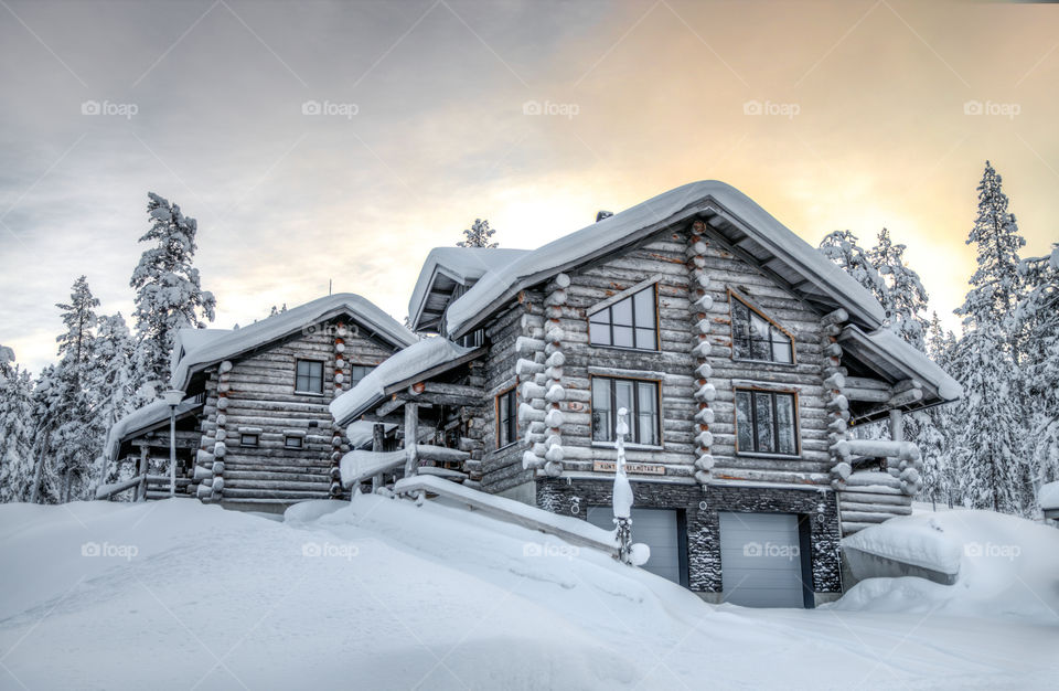 Houses in winter during sunset