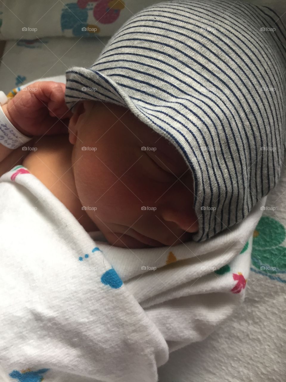 Baby boy in his fedora beanie, the first thing Dad bought him. 