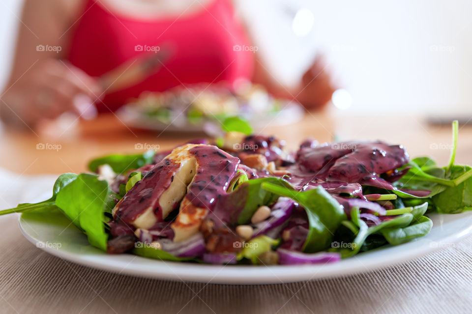 Cypriot halloumi cheese salad with a dollop of blueberry sauce.