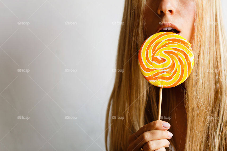 Woman and colorful candy lollipop 