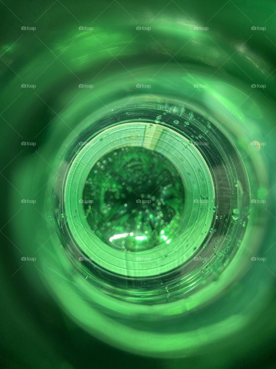 A shot of the inside of a San Pellegrino water bottle while quenching my thirst and playing around on a recent hot summer day. Sparking water and brilliant green  capture the spirit of summer. 