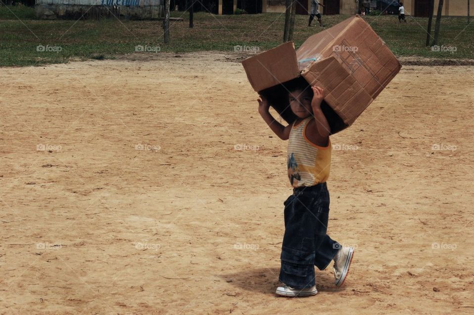Boy carrying box