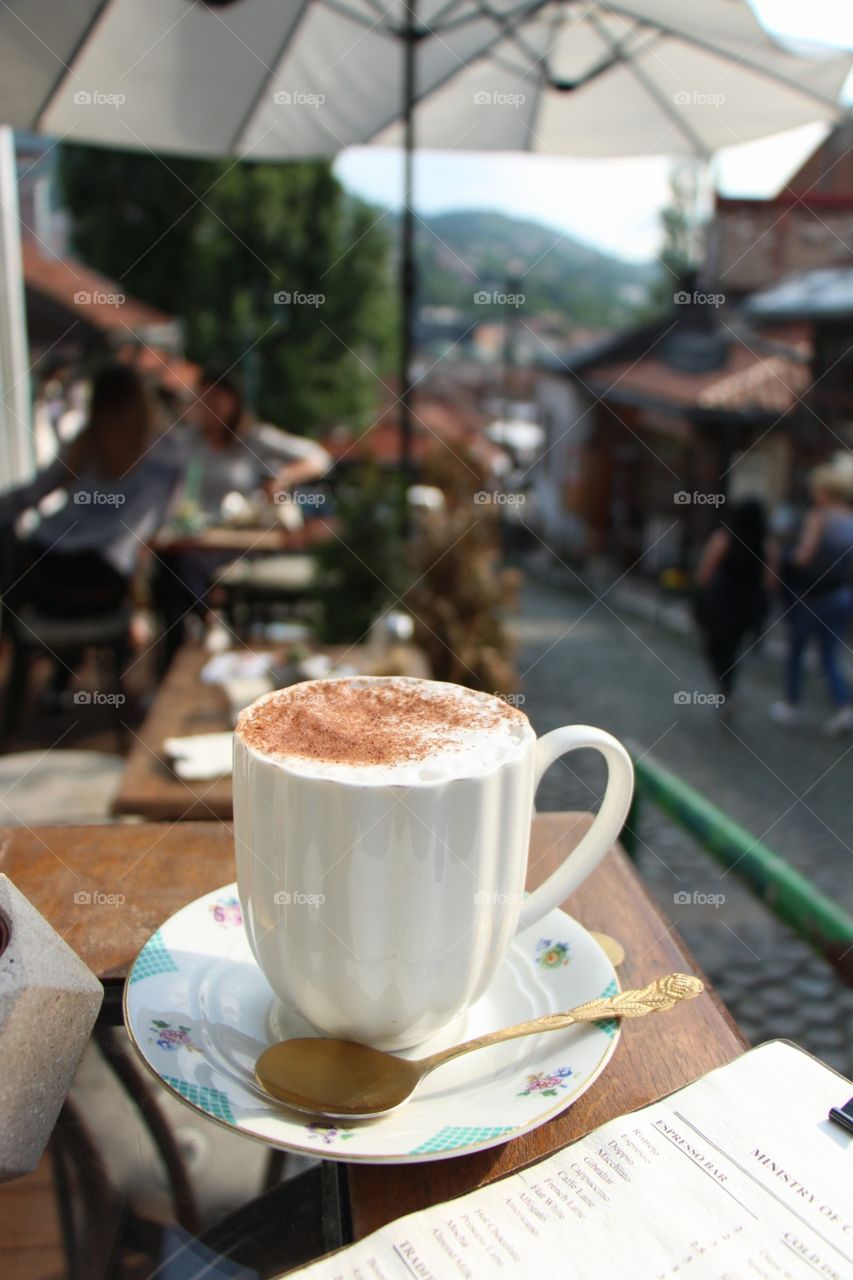 Drinking traditional turkish drink called salep in amazing place in Sarajevo in one of the old traditional streets