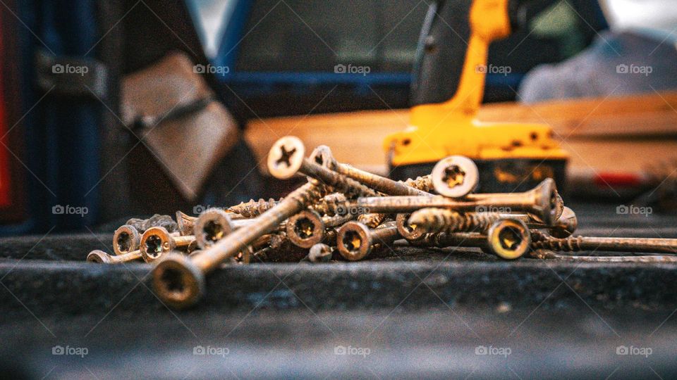 Pile of screws macro in the back of a truck.