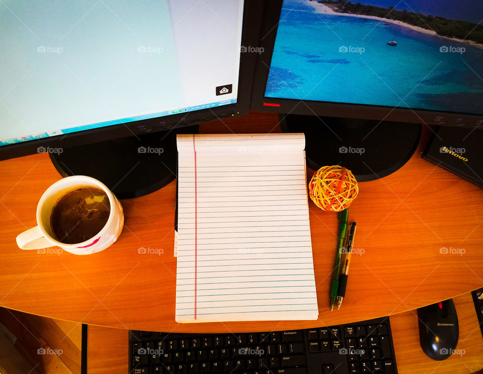 These days one monitor won't cut it, but hey  a rubber band ball helps right?