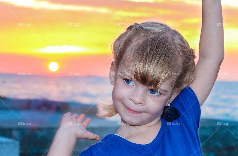 Cute child at sunset