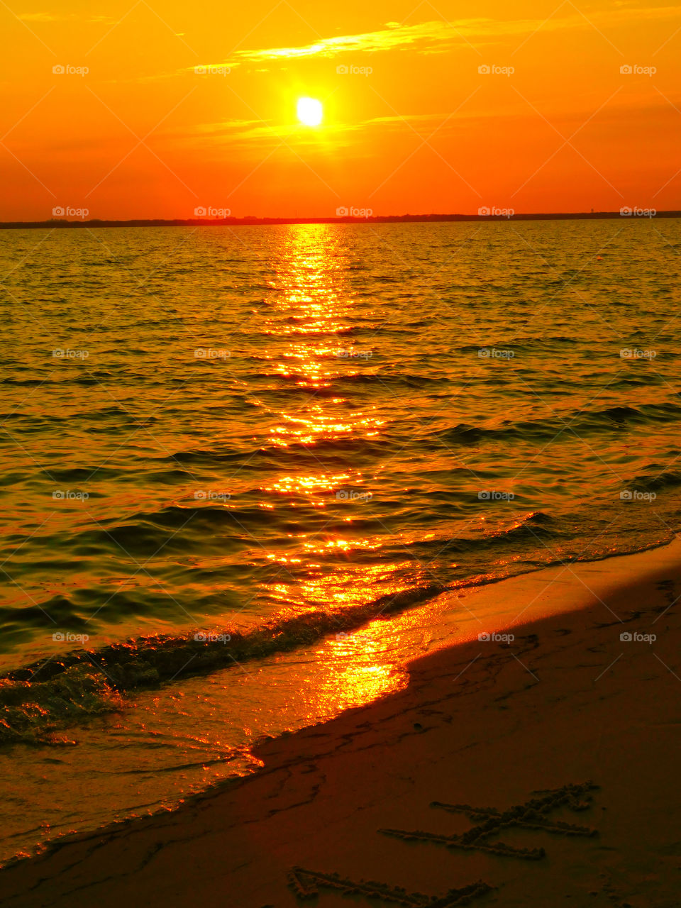 The sky was filled with the most brilliant orange complimented perfectly with hues of gold, yellow, red and crimson. An orange haze had casted over the water, reflecting off every wave.  Finally,the sun disappears along with the shine. I can only wait to see another magical moment of beauty and warmth! I can only wait for another sunset! Enjoy!