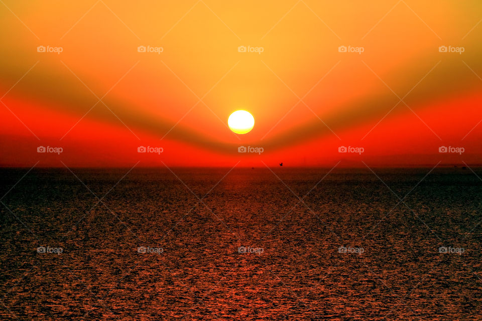 sunset captured amidst gulf of Aden ocean..sun rays shines on the ocean water