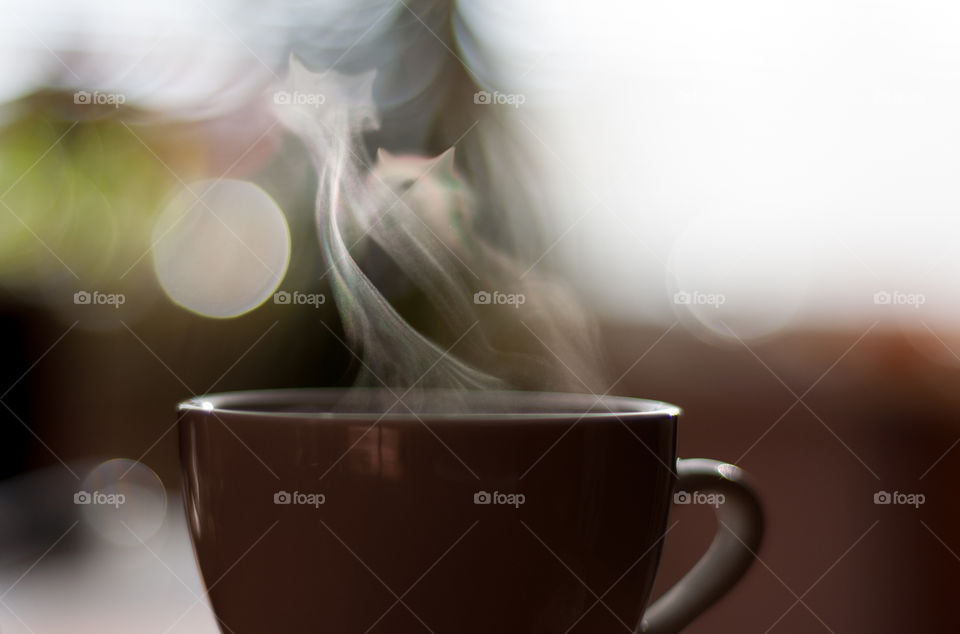 Brown coffee cup with steam
