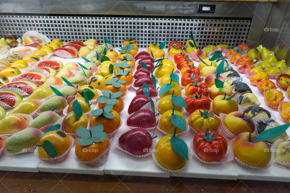 Colorful desserts and pastries in a store in Cefalu on Sicily.