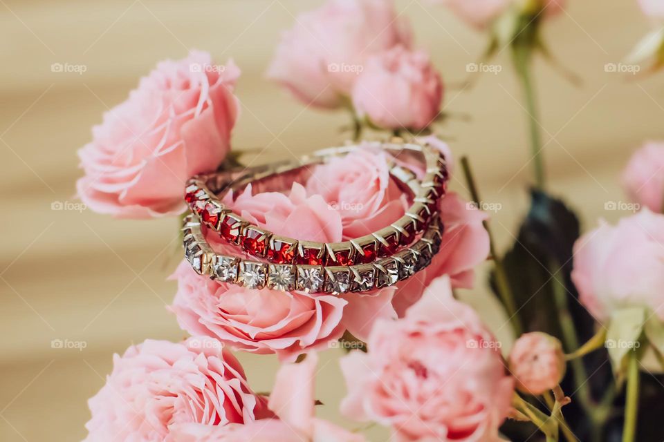 beautiful bracelet on pink flowers