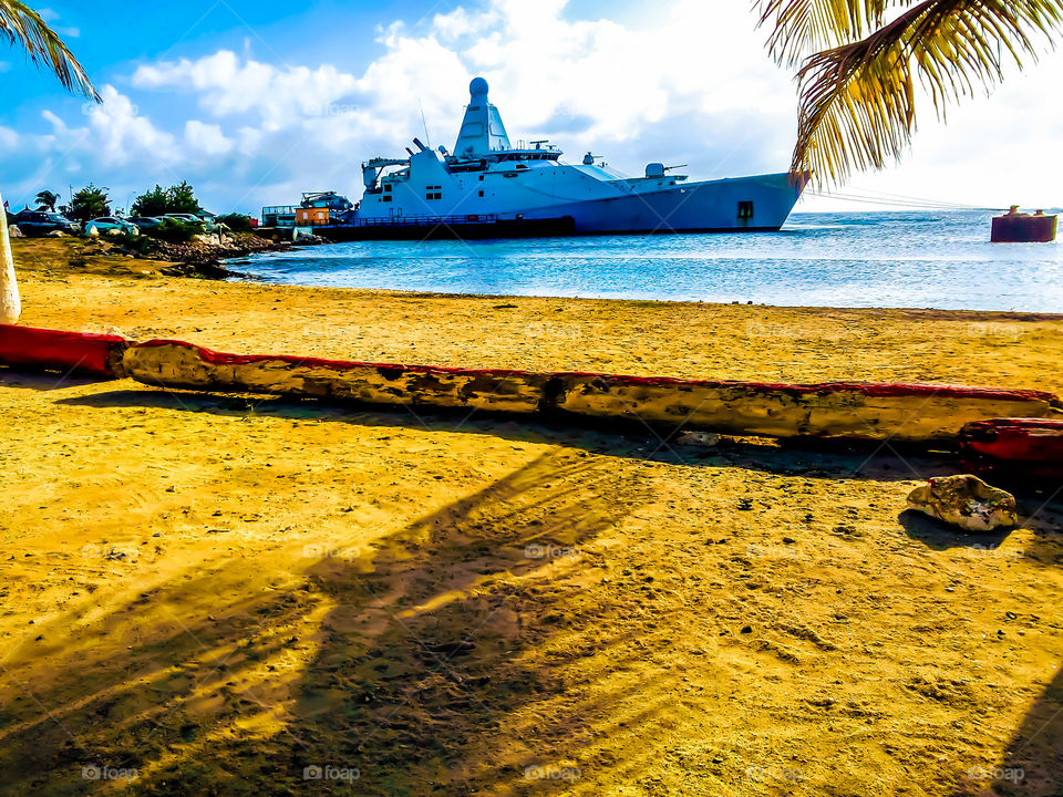 amazing view of a warship on a beatiful beach 🌴