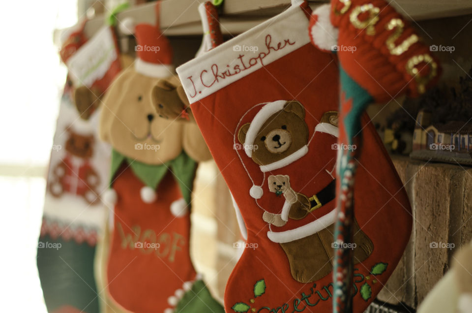 Christmas stockings hanging on the fireplace mantle