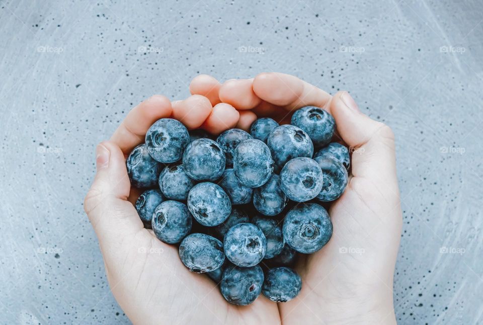 blueberries in the hands