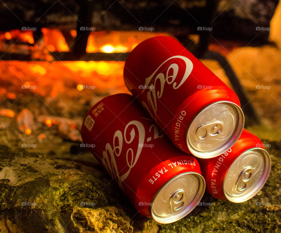 Enjoy a nice Coca-Cola in front of a warm fire