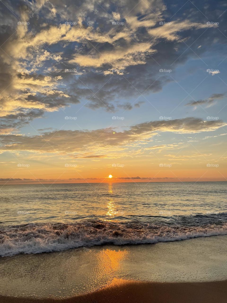 Morning sun rises over the Atlantic Ocean