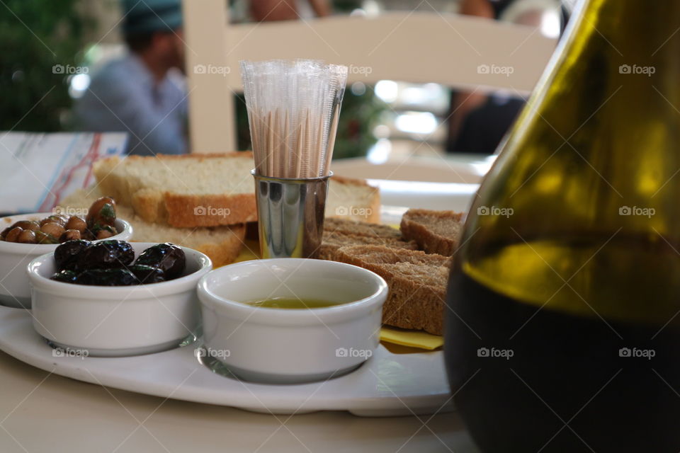 Olives, oil and bread and wine