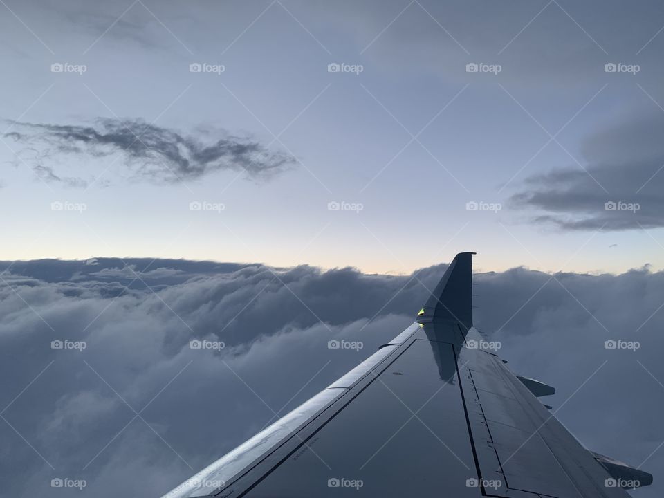 On top of clouds in airplane