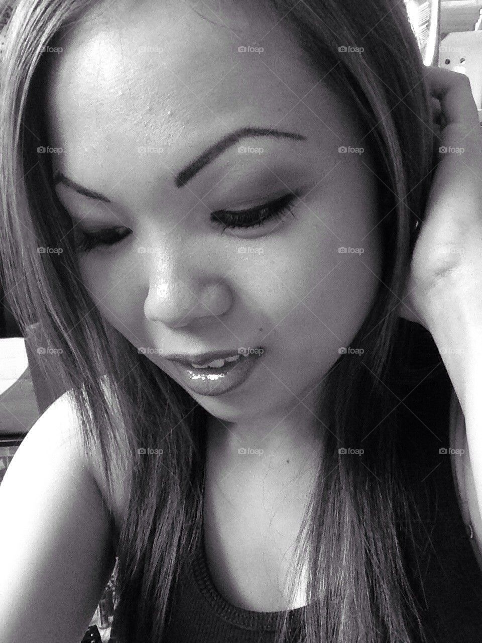 Looking down smiling