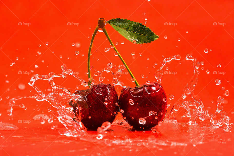 Red cherry with water splash