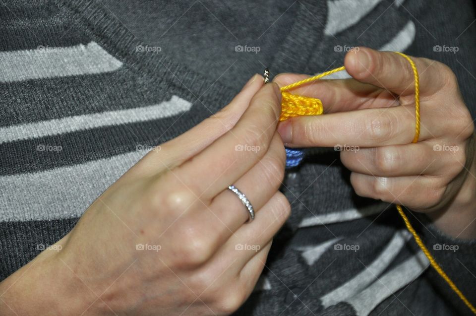 hands with knitting stuff