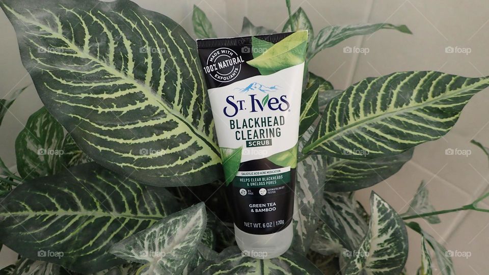 Closeup beauty product I love St. Ives exfoliant cream on plant