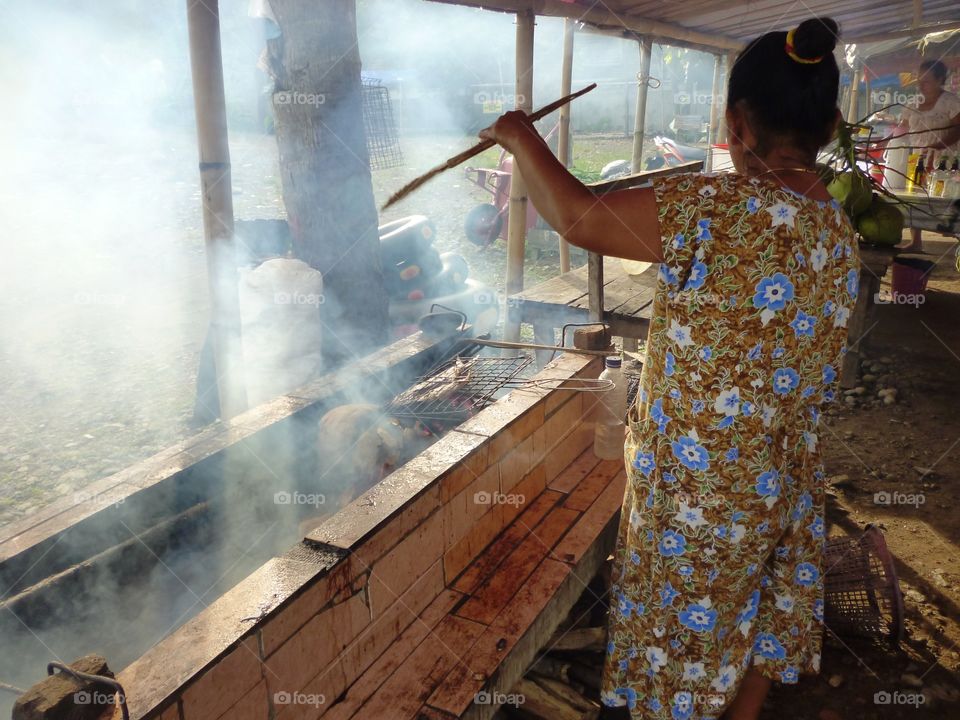 making smoke fish near beach