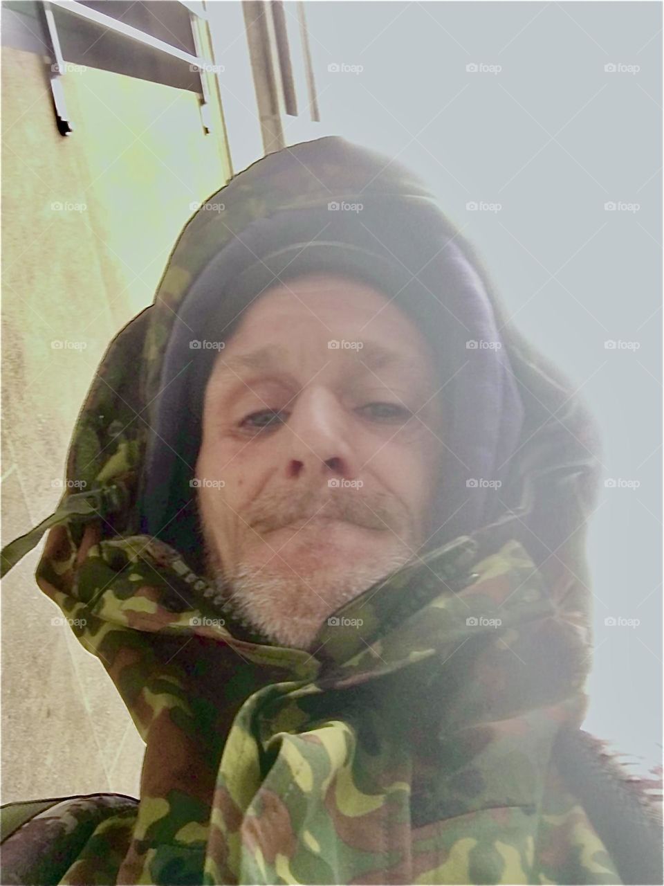 Timothy Trespas in his “military fatigue” style lined winter coat with a hood to keep him warm during the cold season that here in NYC sometimes brings with it sub-zero temperatures down into near arctic levels. 2022. Hypnotic Productions