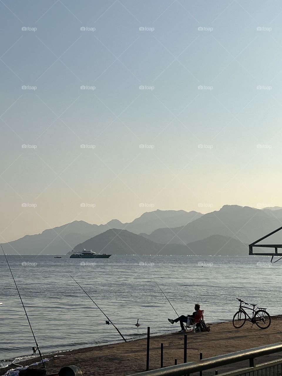 Fisherman on the beach of a Mediterranean sea 
