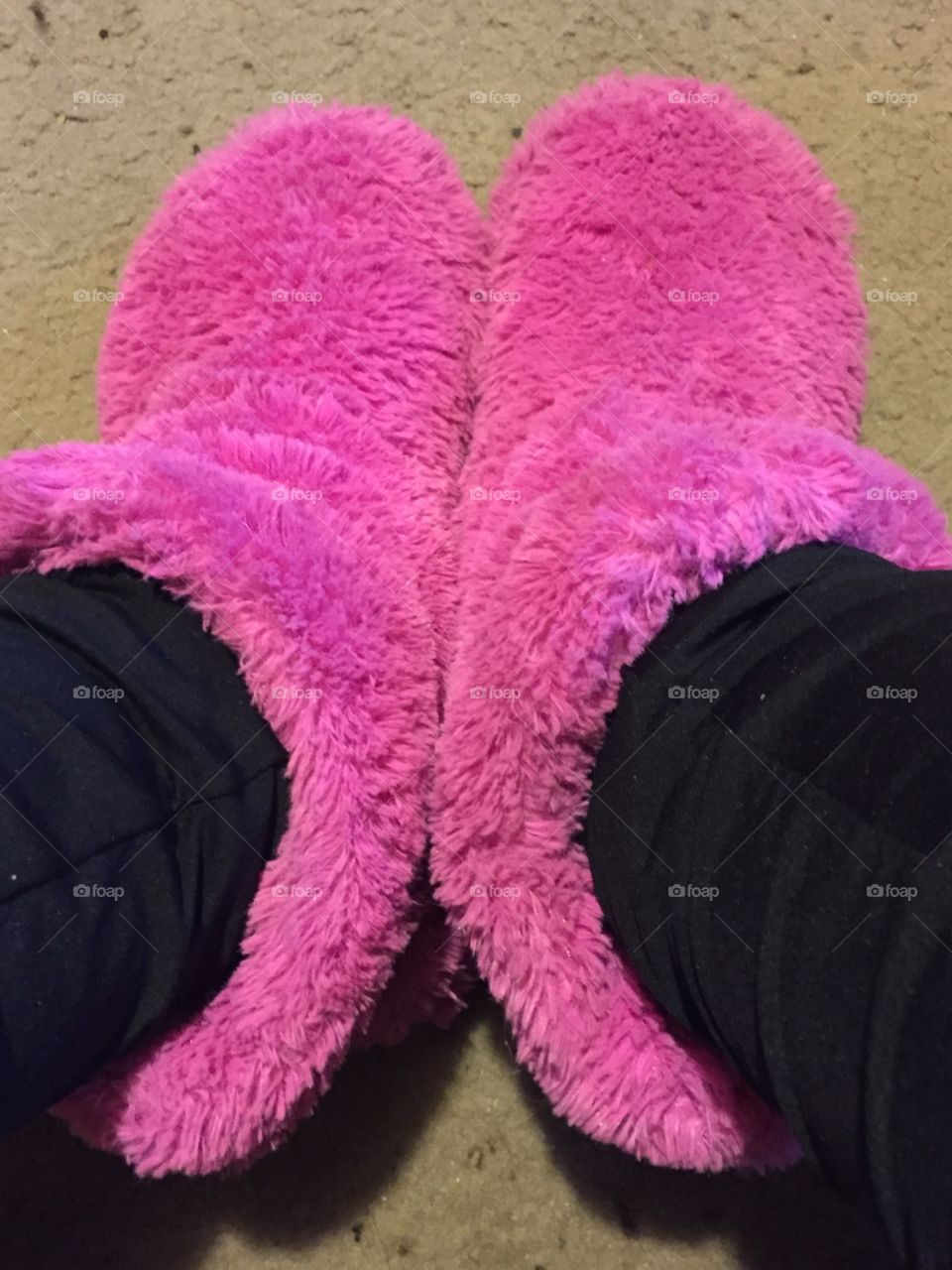 Pink fuzzy slippers help me at the end of a long day 