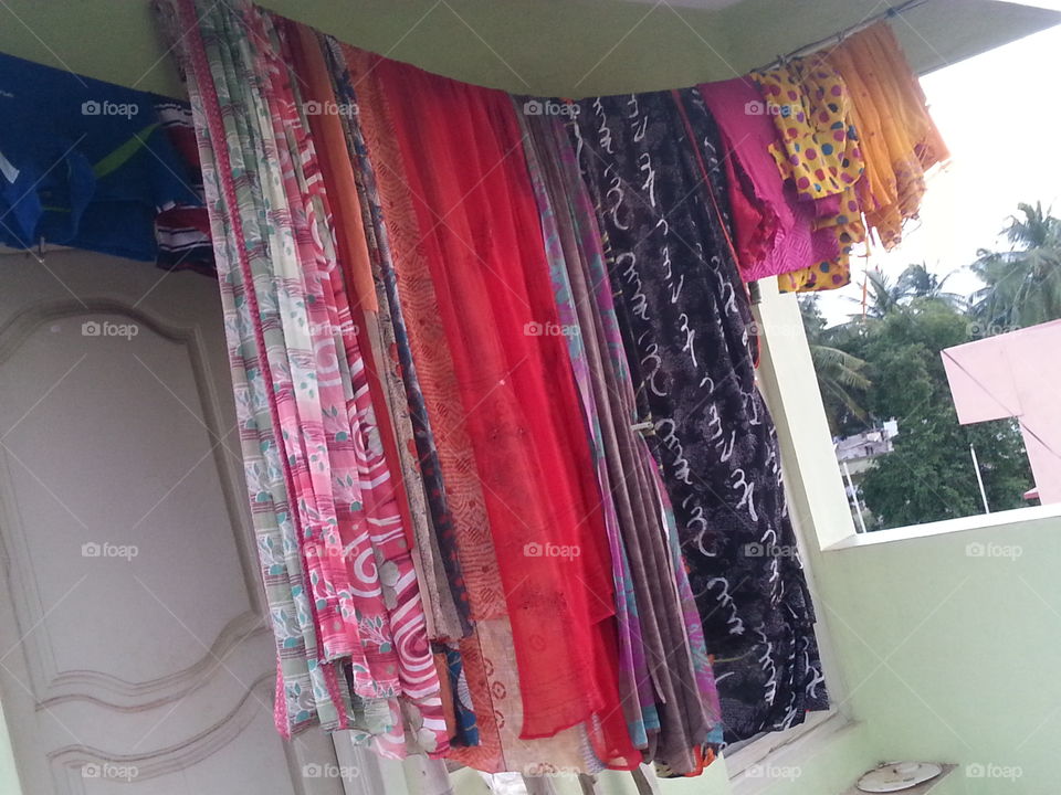 indian sarees. sarees  hanged after wash