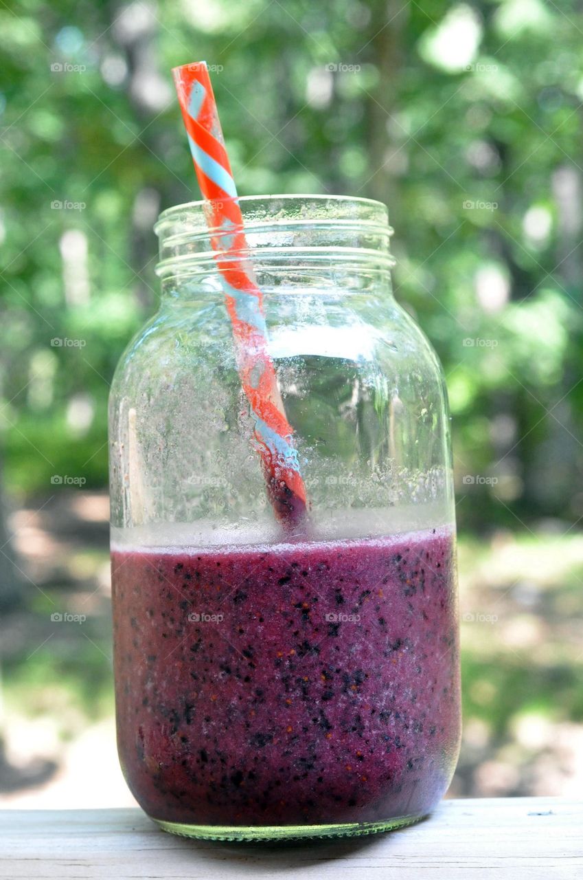 Blueberry and Banana smoothly in a Mason jar