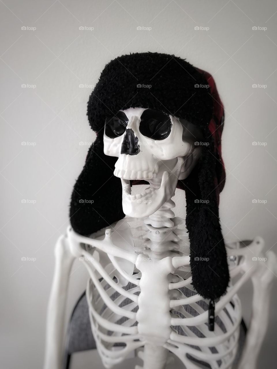 Winter Hat on a Smiling Skeleton