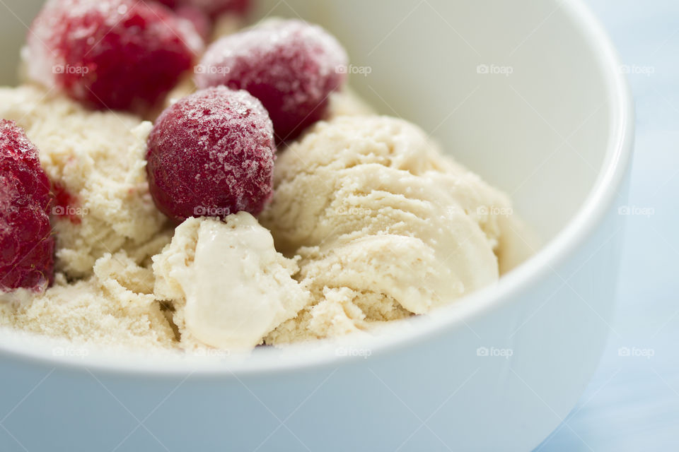 ice cream with cherry and raspberry.