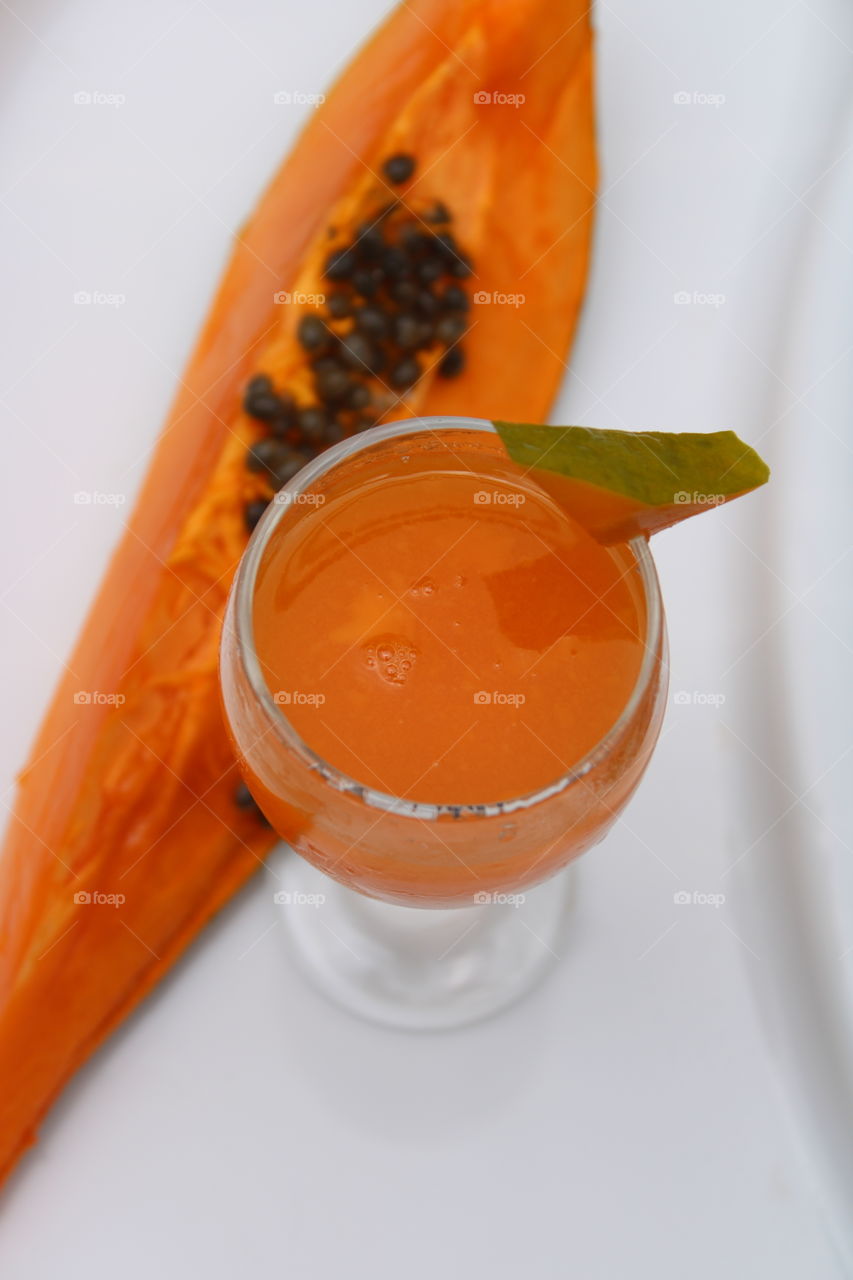 fresh Papaya juice with white colour background