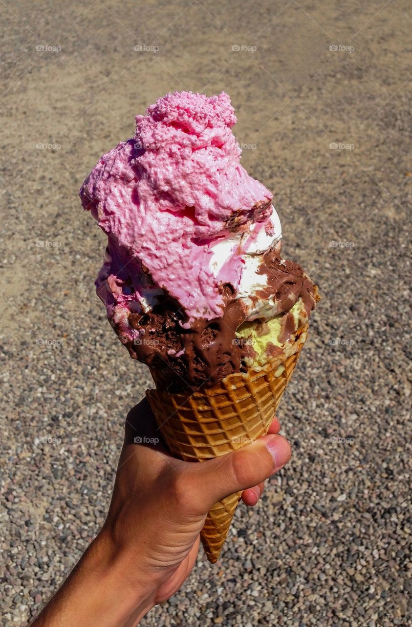 Close-up of hand holding ice cream