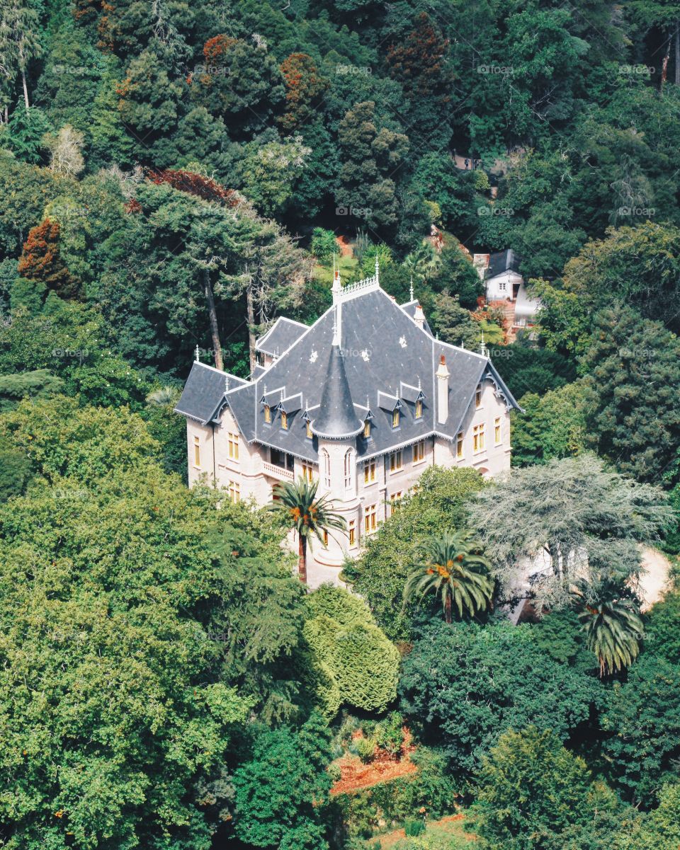 Secluded beautiful mansion in the middle of the forrest viewed from the Moorish Castle in Sintra Portugal