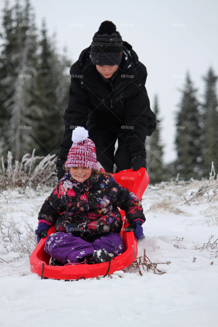 Brother and Sister sledding