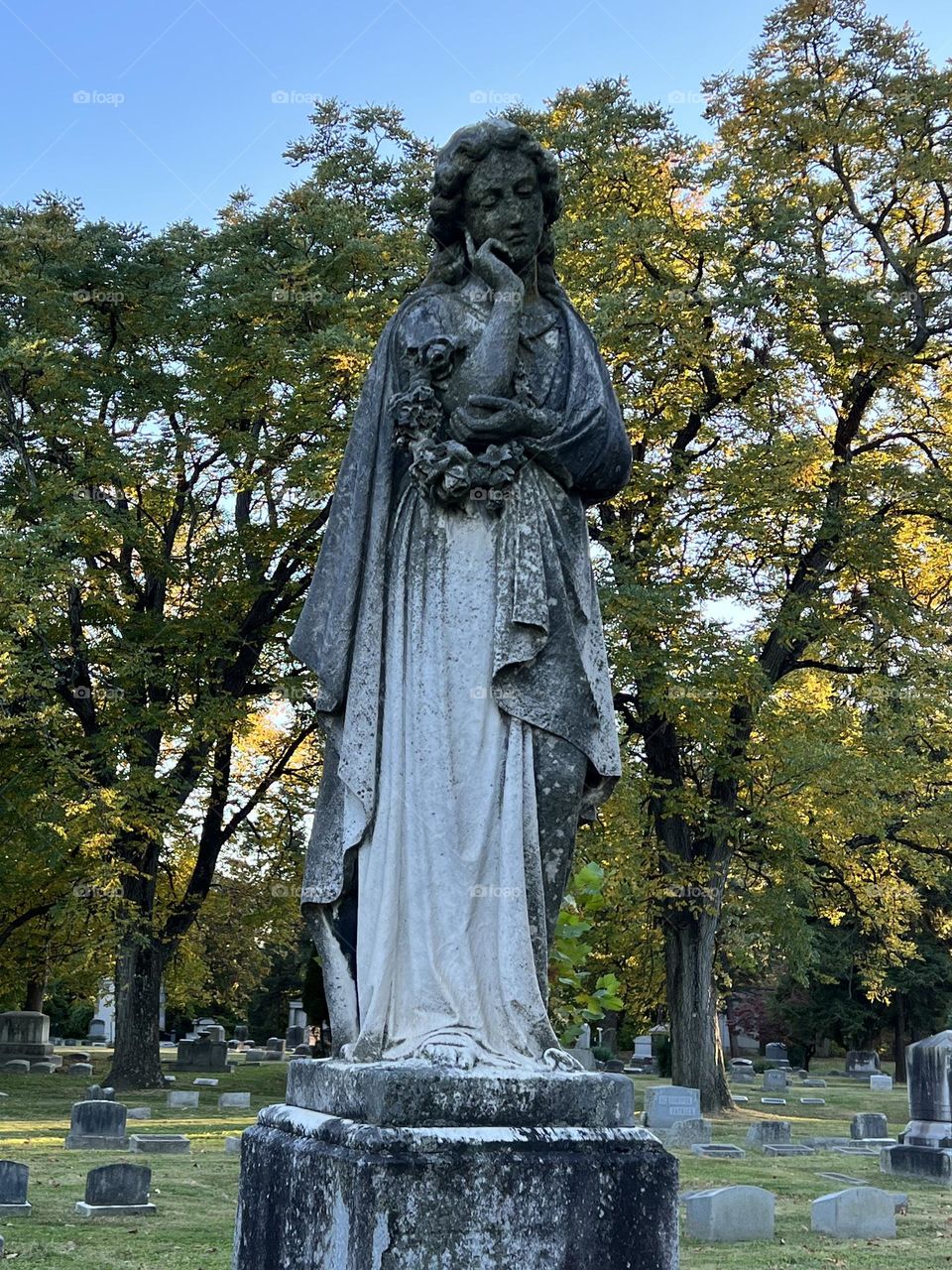 A hauntingly beautiful tombstone statue in an old cemetery in Ohio