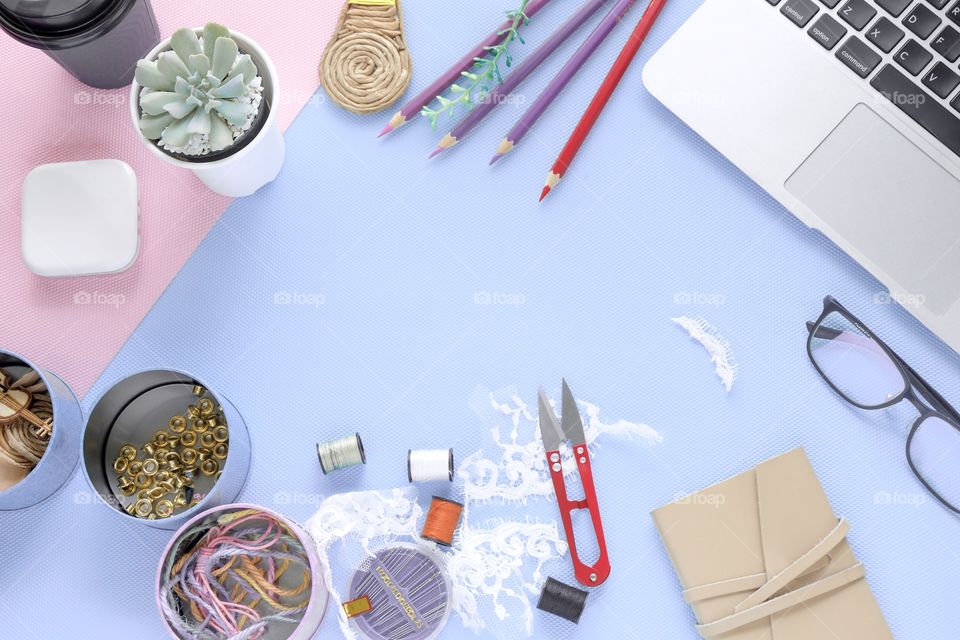 Hobby and materials on soft blue desk