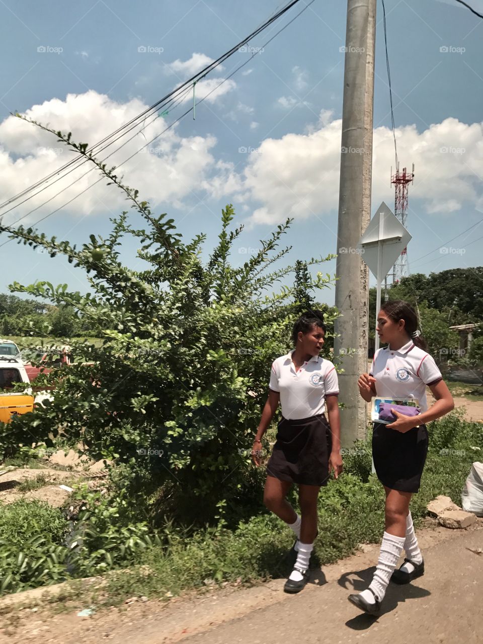 Girls walking in their school uniform in Colombia