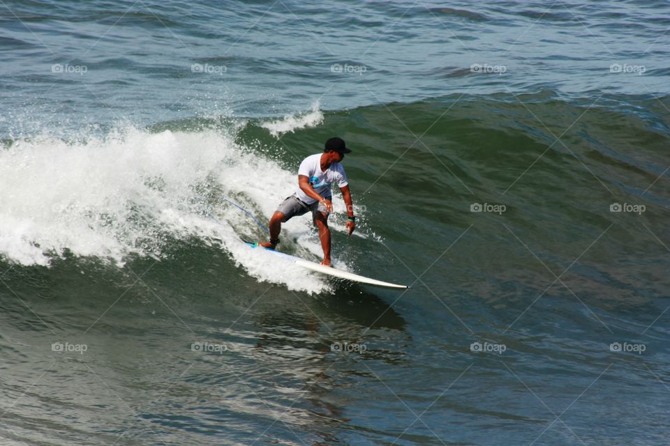 surfing in kuta beach