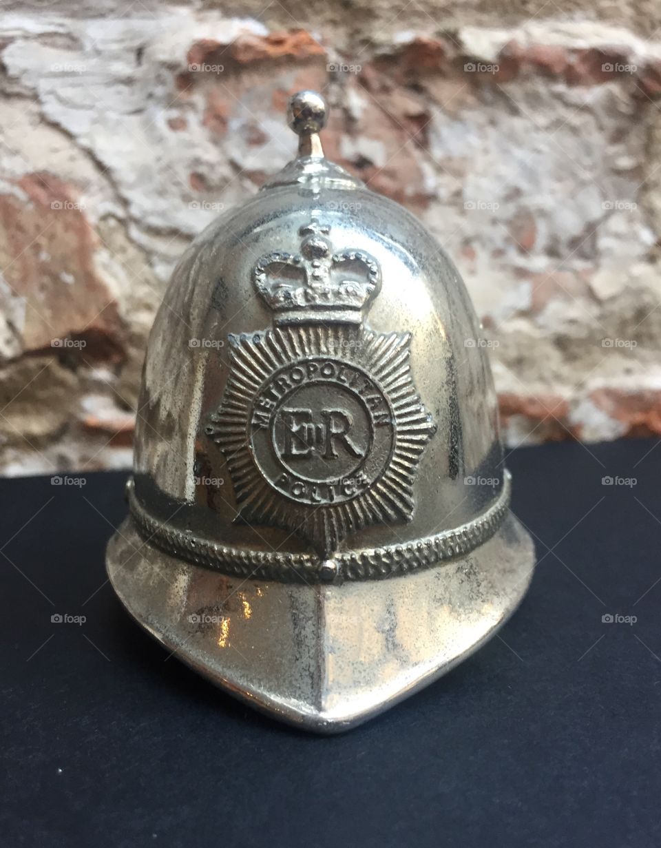 Silver, police helmet shaped hand rung bell