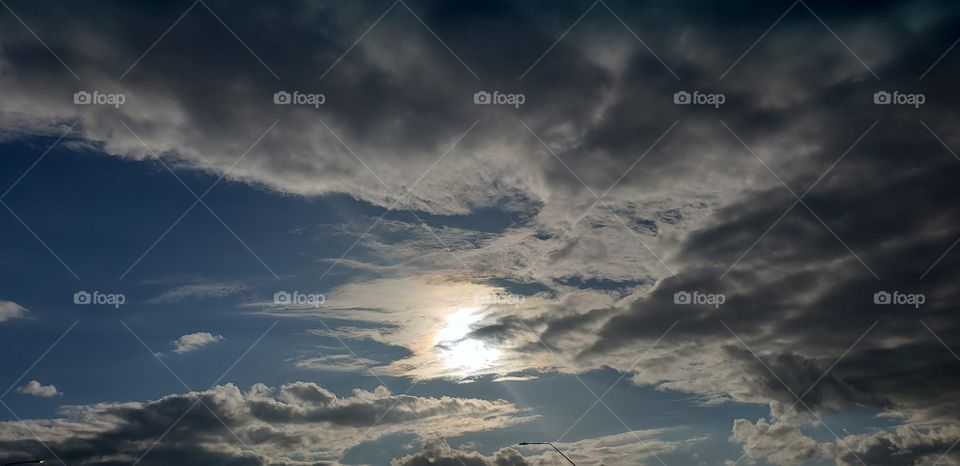 sun shining through the clouds