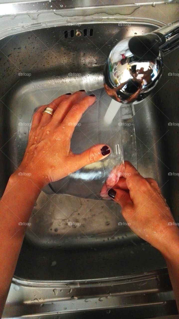 My wife washing kitchen item