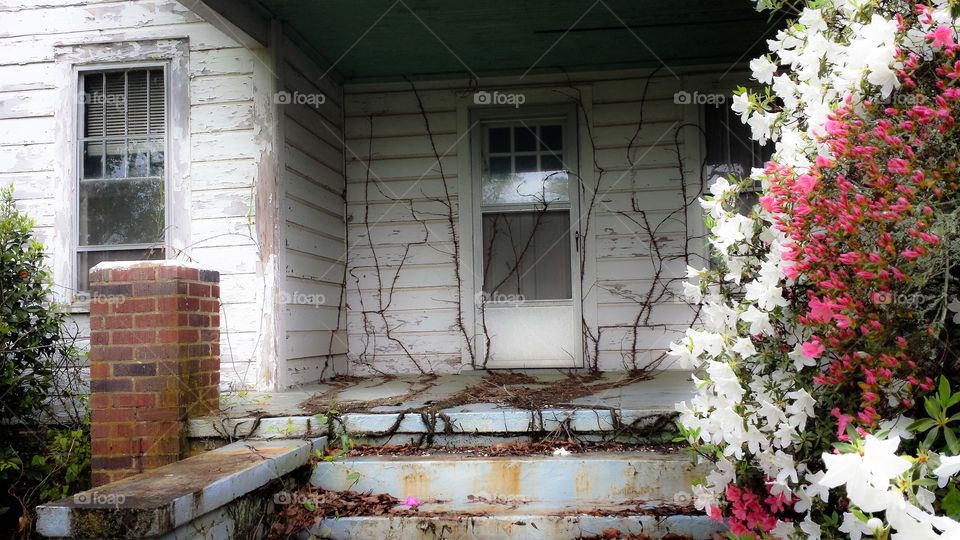 Abandoned Home Porch. A closer look at the old abandoned home.