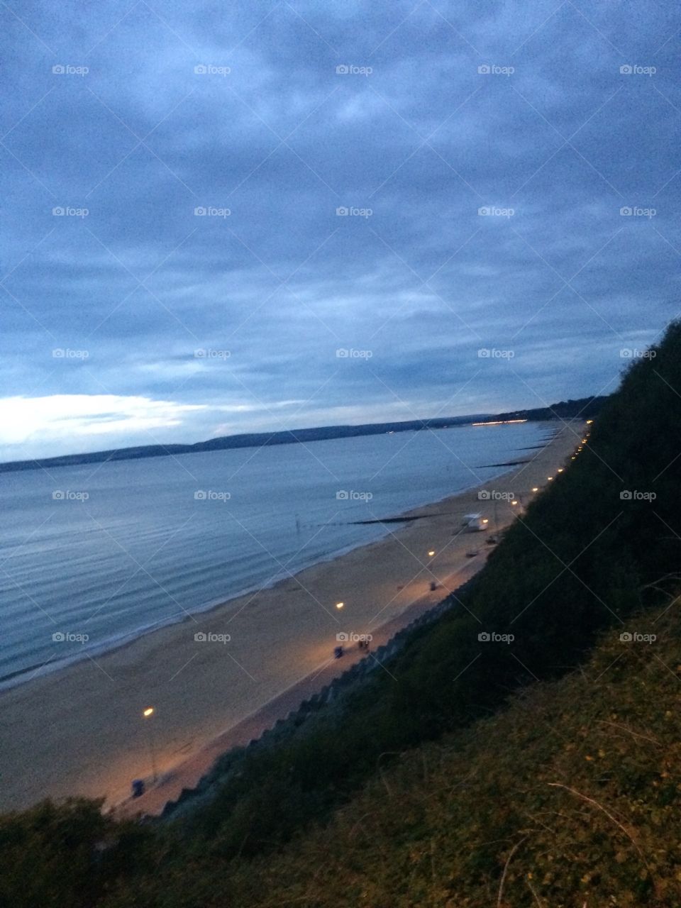 Street lights lighting up the beach 