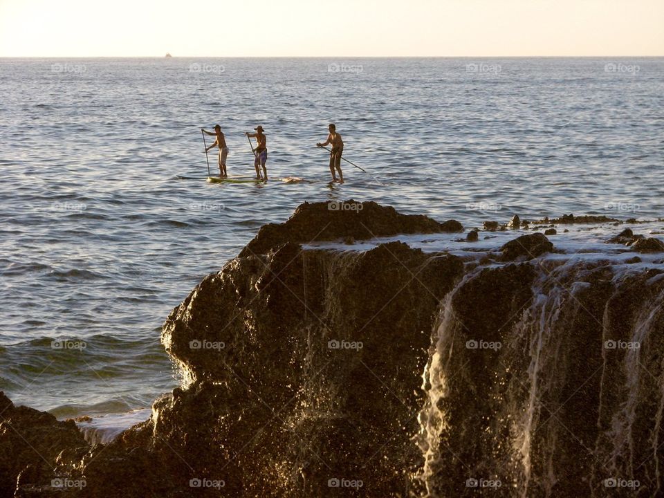 Three Paddle Boarders