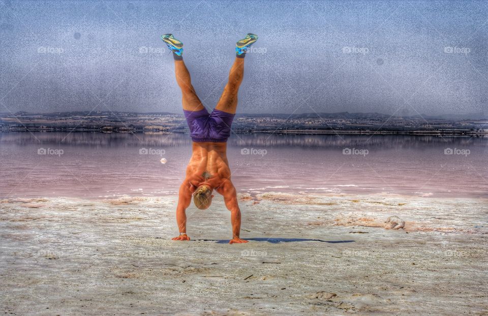 Handstand. Doing handstand by the saltlake in Torrevieja, Spain