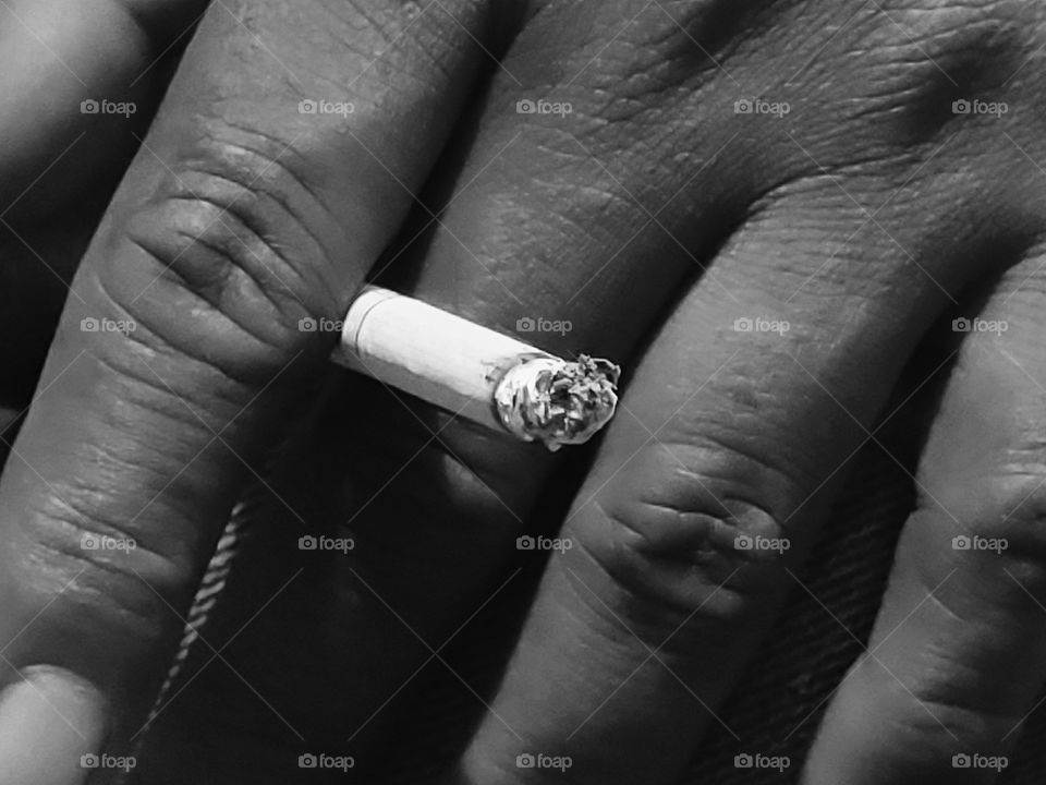 hand and cigarette